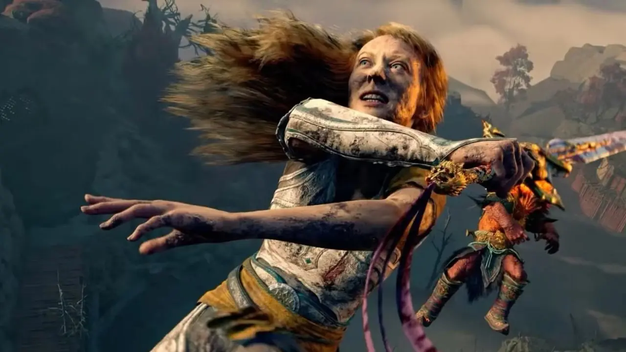 Laufey Mirando su brazo izquierdo mientras habla con el Cubo Gelatinoso en God of War Laufey