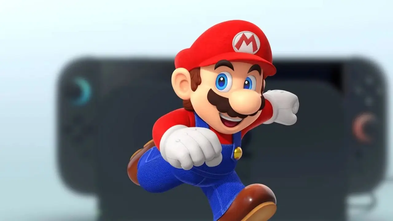 Un'immagine di Mario che corre davanti a una console Nintendo Switch 2 sfocata in modalità dock.