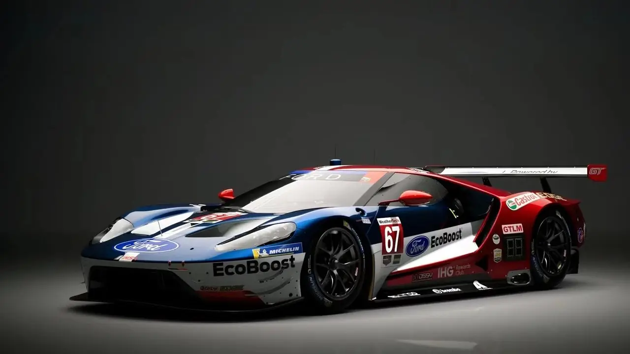 Logotipo de PlayStation con imágenes borrosas de Gran Turismo 7 de fondo.