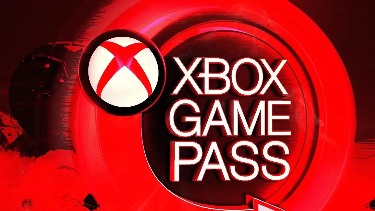 Un letrero redondo de Xbox Game Pass que brilla intensamente en rojo, con un leve efecto de humo visible en primer plano. Un letrero redondo de Xbox Game Pass que brilla intensamente en rojo, con un leve efecto de humo visible en primer plano.